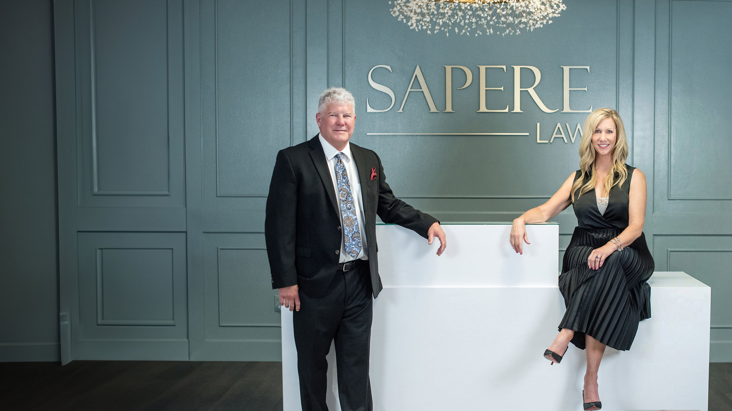 Greg Bennett and Kelly A. Bennett in the reception area of the Sapere Law office.